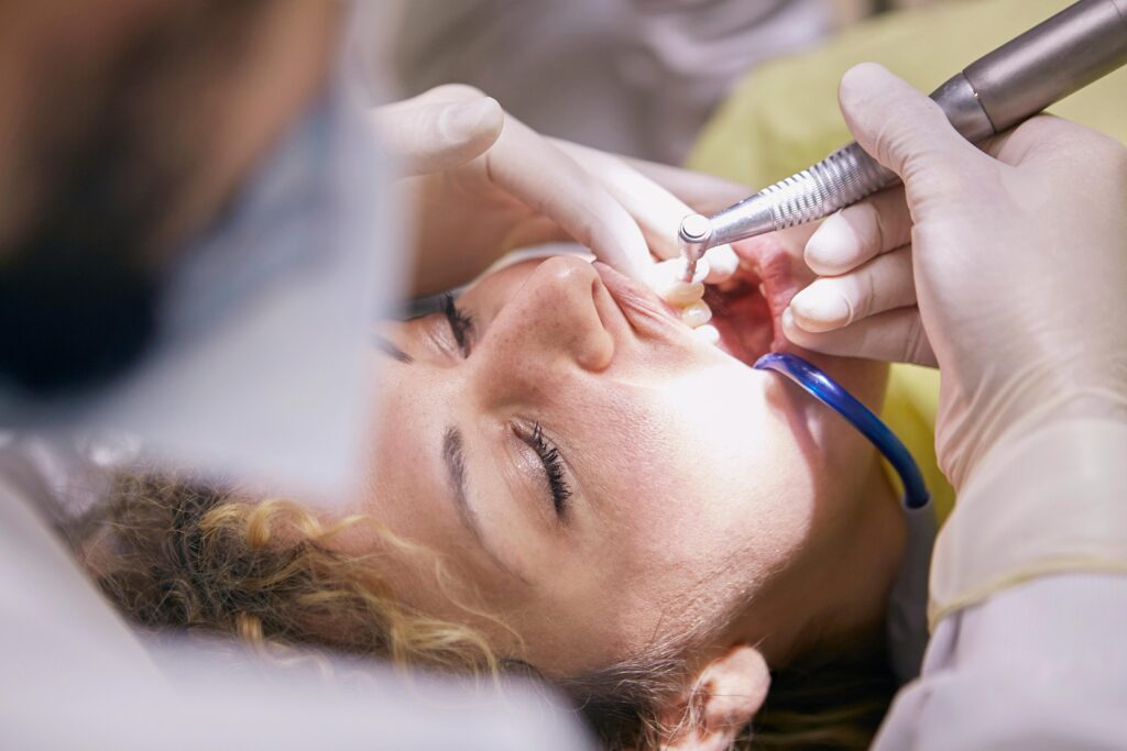 Close-up of a dental procedure with expert dentist and patient in a clinic setting.